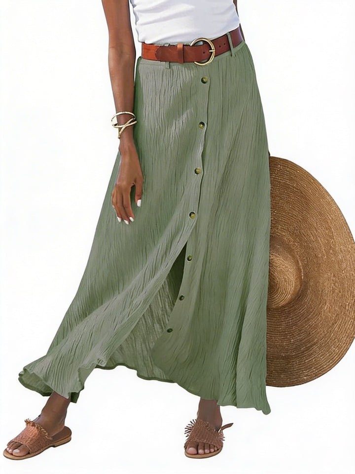 Dames lange maxi rok met knoopsluiting en trendy kreukstof, ideaal voor een zomerse of elegante look.