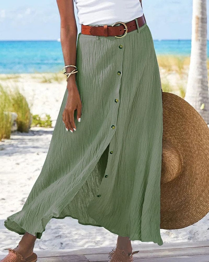 Elegante A-lijn damesrok, lange maxi lengte, met knoopsluiting en kreukstof. Perfect voor vrouwenmode.