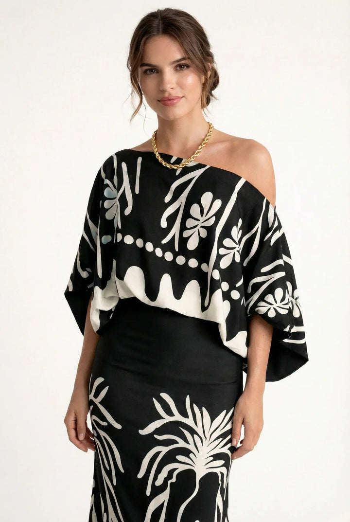 Stijlvolle dames rokblouseset met unieke lenteprint. Deze comfortabele set is perfect voor zomerse dagen en avonden.