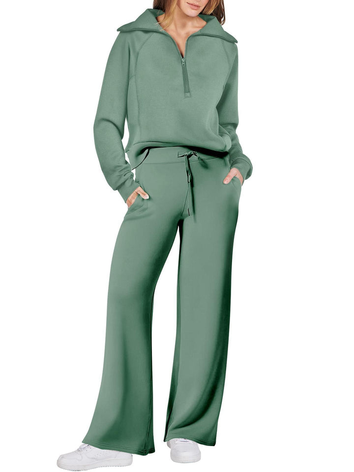 Dames loungewear set met lange mouwen, functionele ritssluiting en comfortabele pasvorm.
