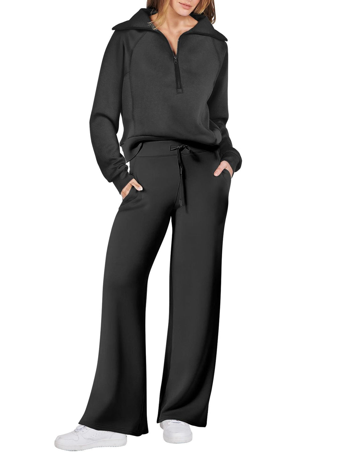Tweedelige dames loungewear set: top met lange mouwen, ritssluiting en bijpassende comfortabele broek.