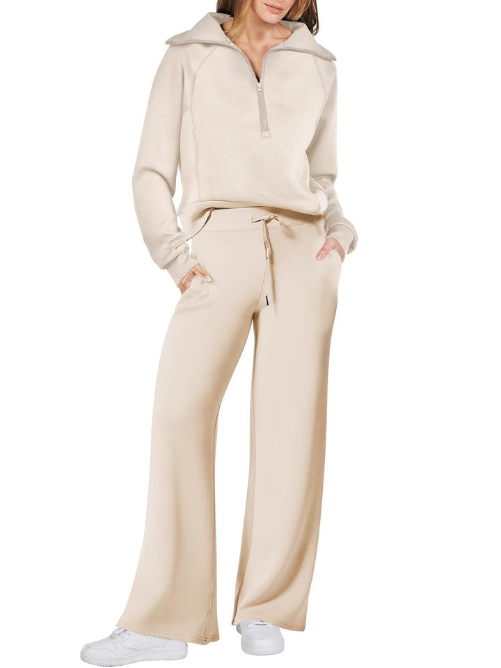 Zachte dames loungewear set met lange mouwen en ritssluiting, heerlijk comfortabel voor ontspanning thuis.