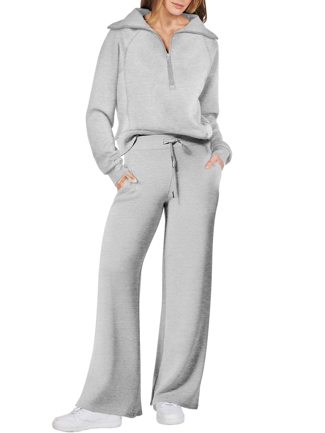 Comfortabele dames loungewear set met lange mouwen en ritssluiting, perfect voor koudere dagen thuis.