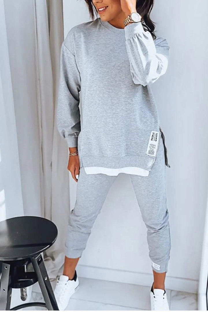 "Dames loungewear set, zachte katoen-polyester mix, relaxed sweatshirt en taps toelopende broek, stijlvol en comfortabel."