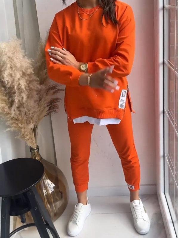 "Dames loungewear set, zachte katoen-polyester mix, relaxed sweatshirt en taps toelopende broek, stijlvol en comfortabel."