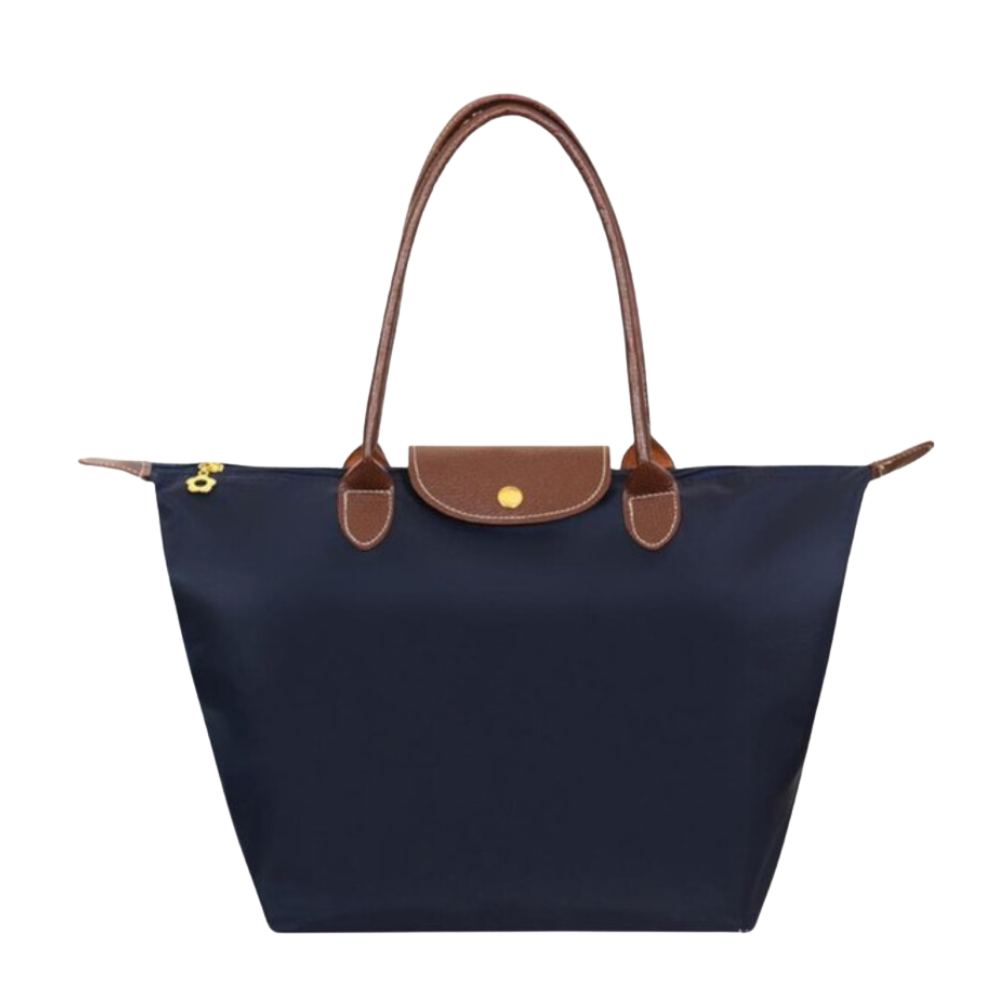 Model draagt casual stijlvolle dames draagtas van waterafstotend nylon. Ideale schoudertas.