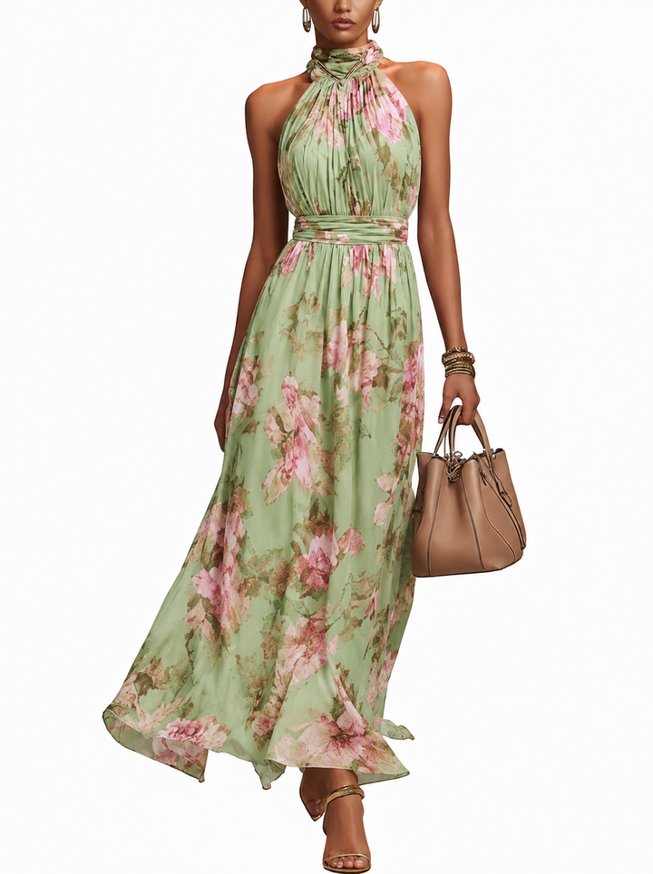 Dames maxi jurk groen met elegante bloemenprint en halternek. Ideaal voor zomerse feesten en gelegenheden.