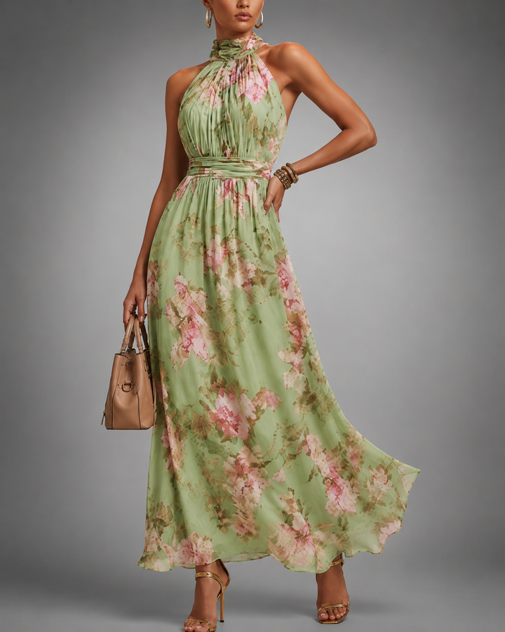 Chique dames zomerjurk groen met bloemenprint, halternek en A-lijn; een elegante keuze voor elke gelegenheid.