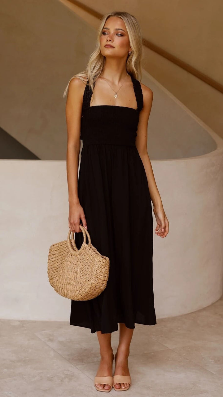 Smock dames maxi jurk met vierkante hals, mouwloos en een verrassende open rug voor een moderne uitstraling.