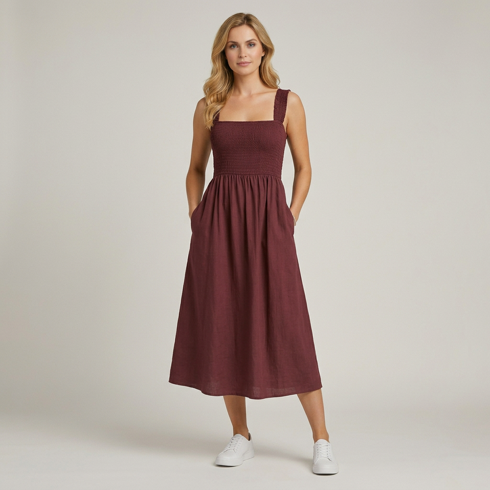 Elegante mouwloze maxi jurk voor dames met smock, vierkante hals en verleidelijke open rug.