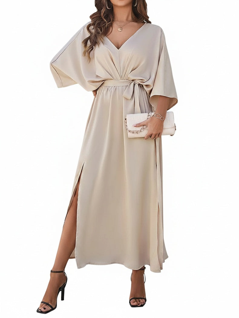 Dames maxi jurk met V-hals, elegante vleermuismouw en strikceintuur. Perfecte feestjurk voor avondkleding.