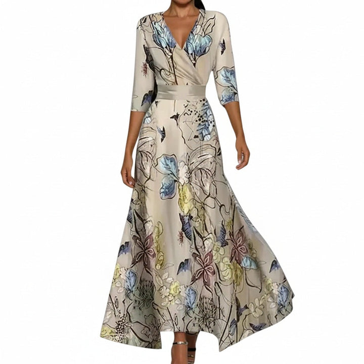 Dames maxijurk met elegante bloemenprint, V-hals en driekwart mouwen. Ideaal als zomerjurk of feestjurk.