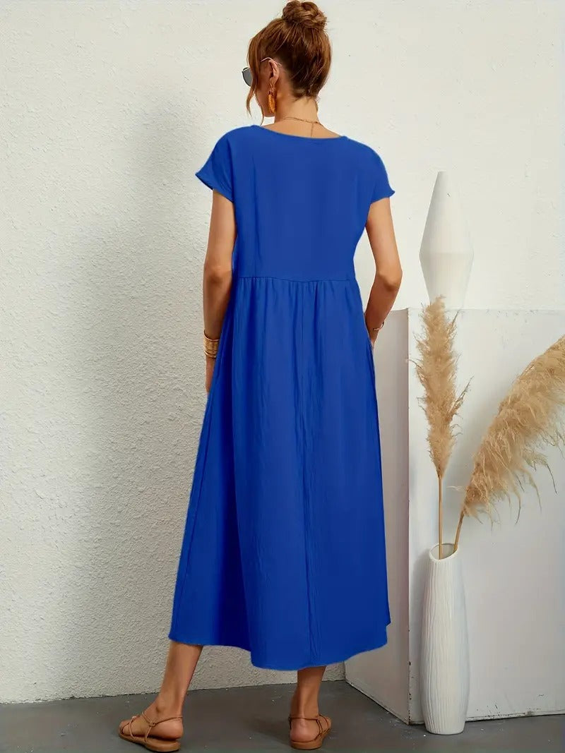 Trendy dames jurk, midi lengte, korte mouwen, zakken en elegante geplooide rok.