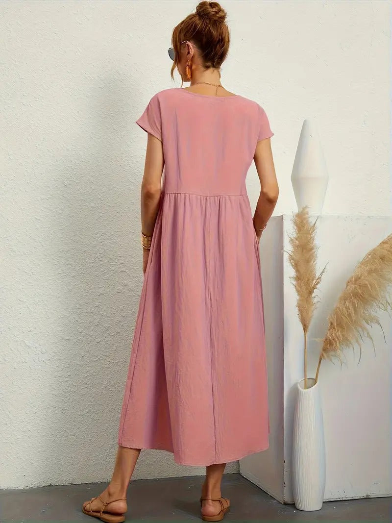 Stijlvolle midi jurk met korte mouwen, geplooide rok en zakken. Essentieel voor dames.