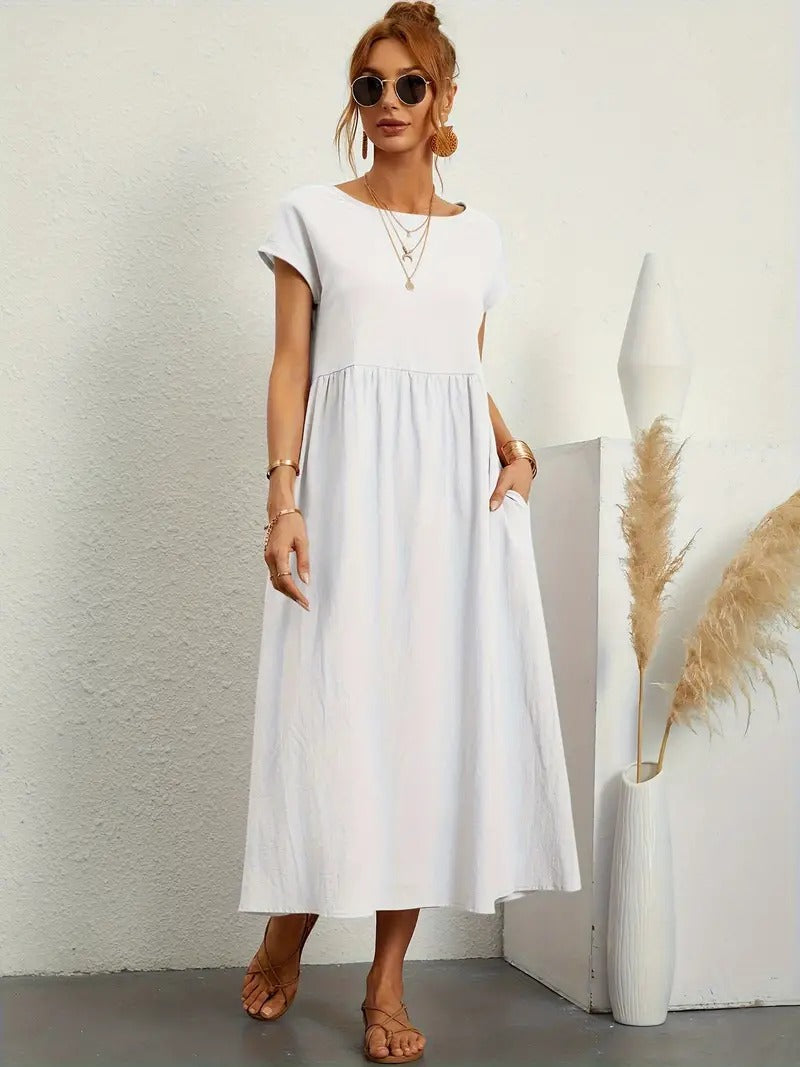 Veelzijdige zwarte midi jurk, korte mouwen, zakken, geplooide rok. Elegant & comfortabel.