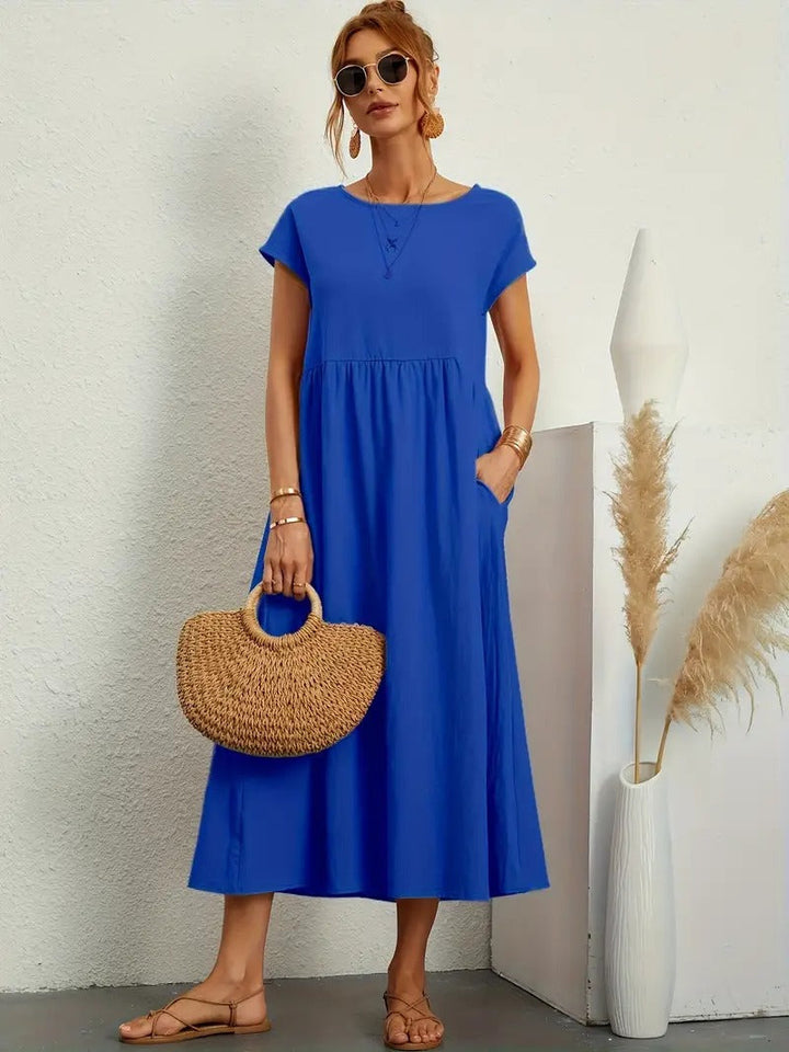 Casual zwarte dames midi jurk met ronde hals, korte mouwen en stijlvolle geplooide rok.