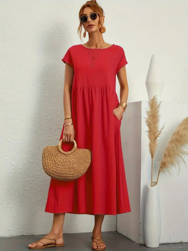 Midi jurk dames, korte mouwen, zakken, elegante geplooide rok. Perfecte zomeroutfit.