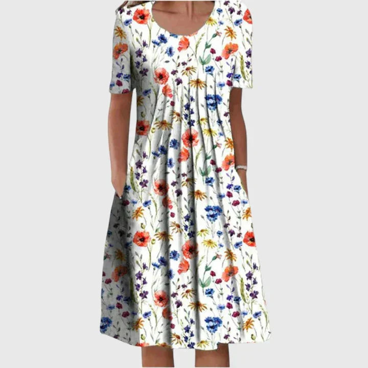 Elegante A-lijn midi jurk voor dames met bloemenprint en korte mouw, comfortabel voor casual zomerse dagen.