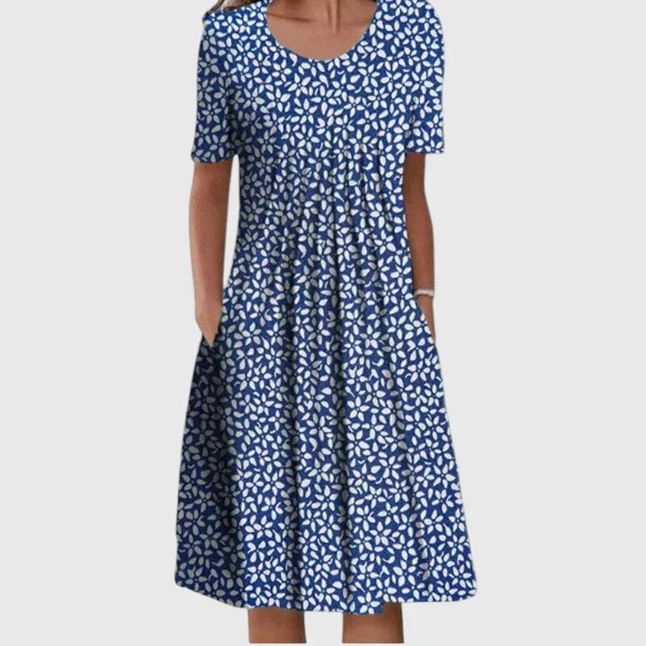 Zomerse dames midi jurk met levendige bloemenprint, korte mouw en ronde hals, perfect voor elke gelegenheid.