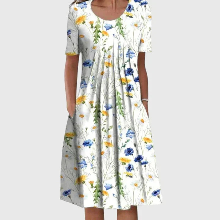 Stijlvolle dames midi jurk met kleurrijke bloemenprint, korte mouw en flatterende A-lijn voor de zomer.