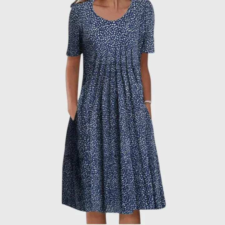 Modieuze dames midi jurk met korte mouw, vrolijke bloemenprint en ronde hals, perfect als zomerjurk.