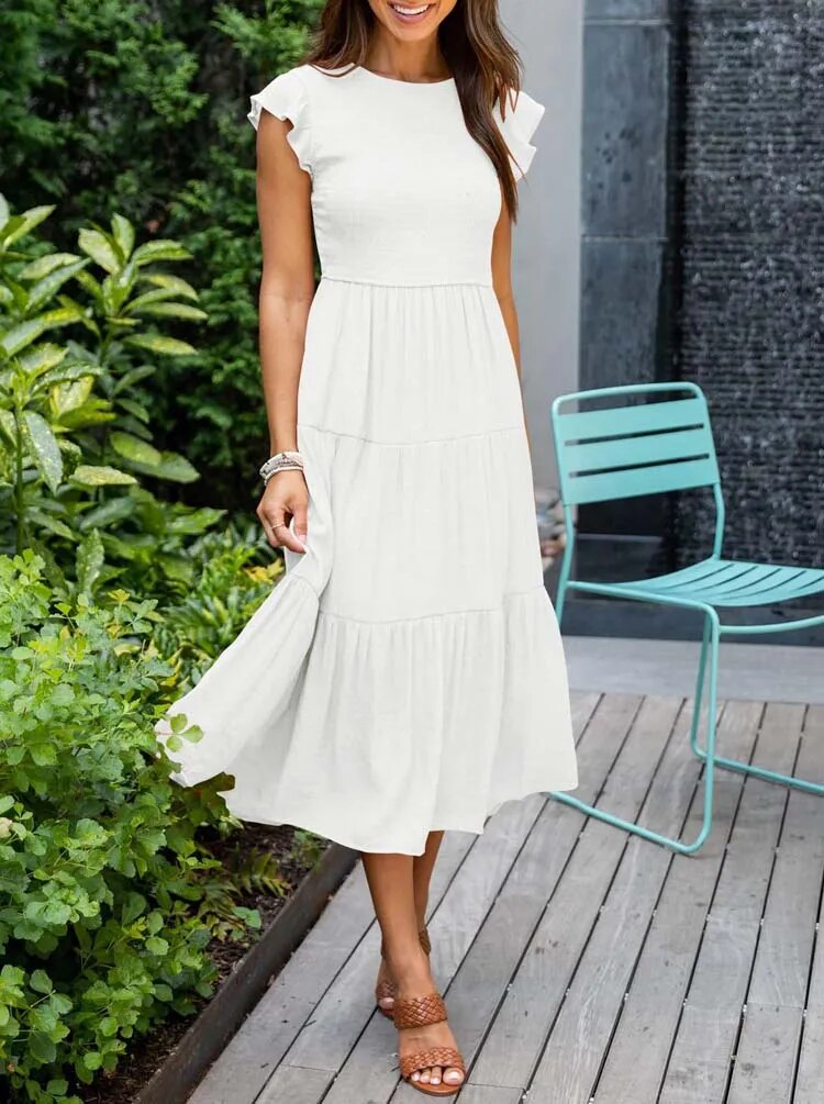 Dames midi zomerjurk met elegante vlindermouwen, perfect voor casual dagen of strand.