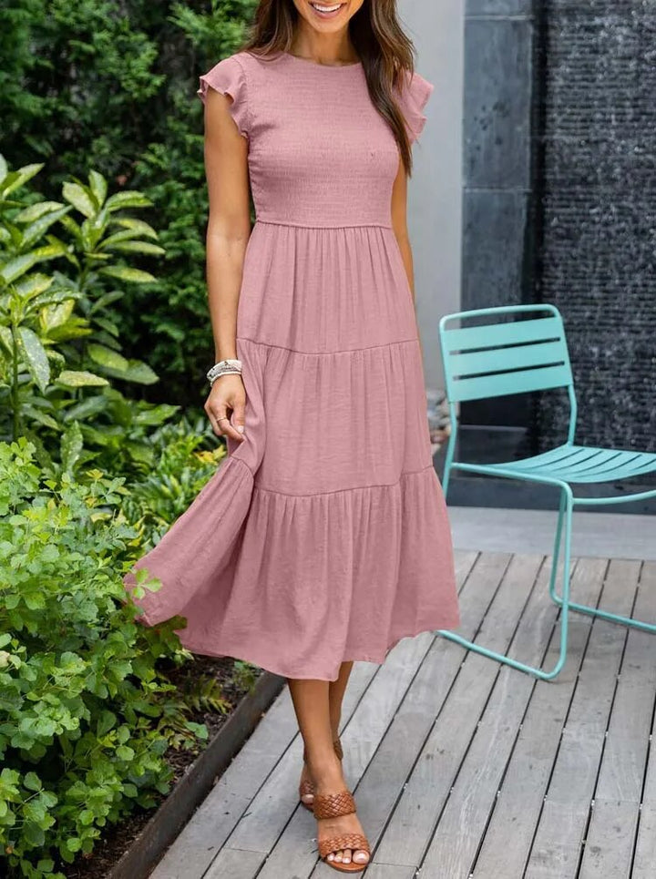 Elegante en comfortabele midi jurk met vlindermouwen, perfect voor zomerse dagen.