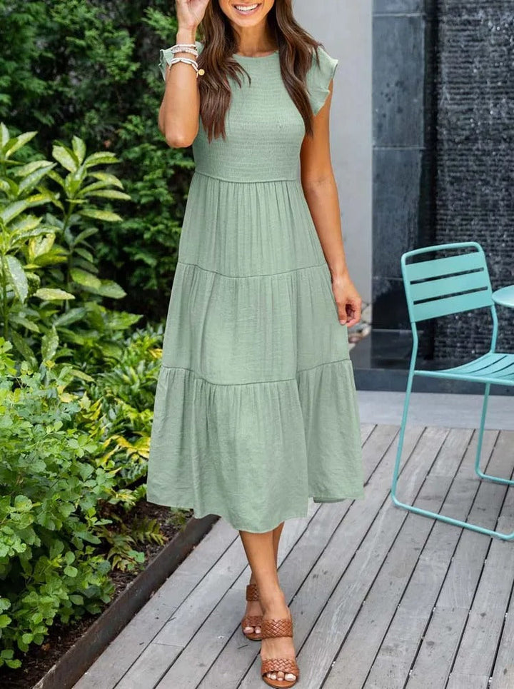 Stijlvolle midi jurk met vlindermouwen; de perfecte casual jurk voor de zomer.