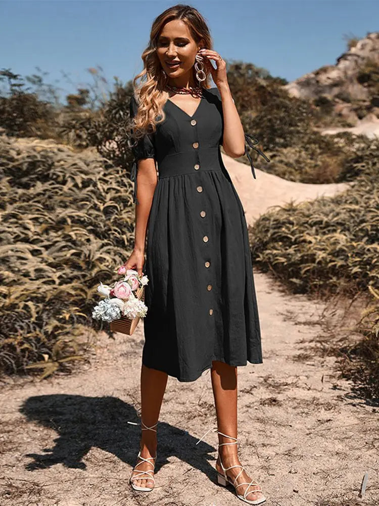 Comfortabele dames midi jurk met knoopsluiting. Een modieuze zomerjurk, perfect voor elke gelegenheid.