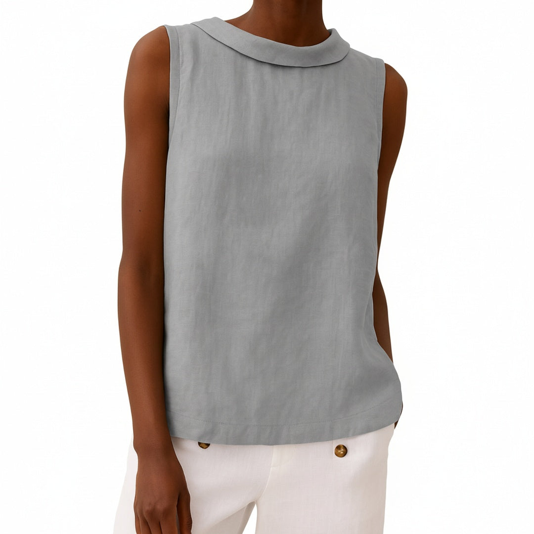 Dames mouwloze blouse met elegante rolkraag en rechte snit, ideaal voor zomerse dagen.