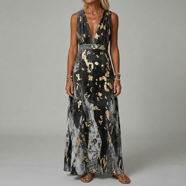 Stijlvolle dames maxi jurk, mouwloos, met diepe V-hals en een verfijnde gouden print. Geschikt voor gala's.
