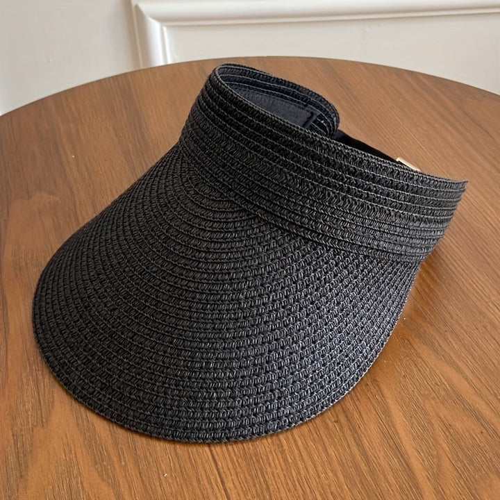 Elegante dames zonneklep, opvouwbaar voor handig transport, met brede rand en UV-bescherming.