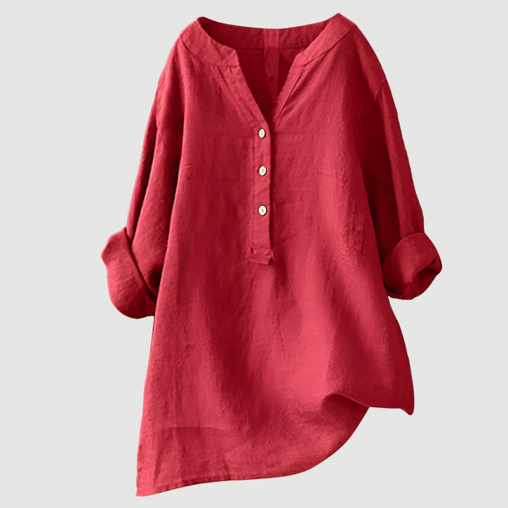Dames oversized blouse met V-hals en lange mouwen, losse pasvorm en knoopsluiting.