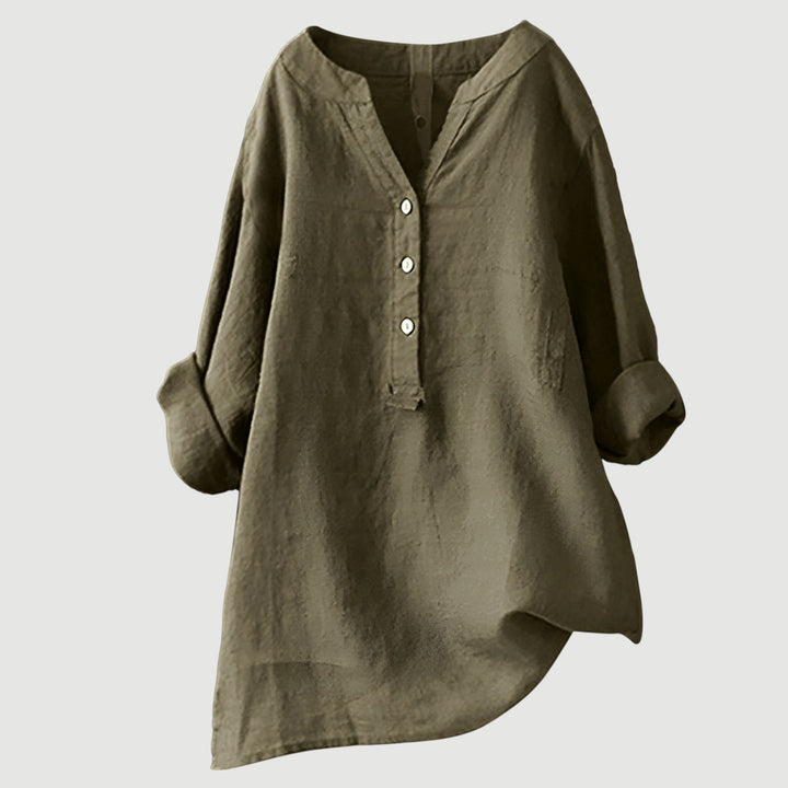 Trendy damesblouse met oversized pasvorm, V-hals en lange mouwen, ideaal voor een stijlvolle outfit.
