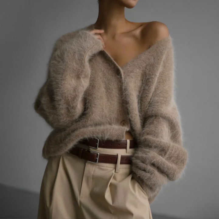 Stijlvol gebreid damesvest, oversized pasvorm, combineert comfort met moderne mode.