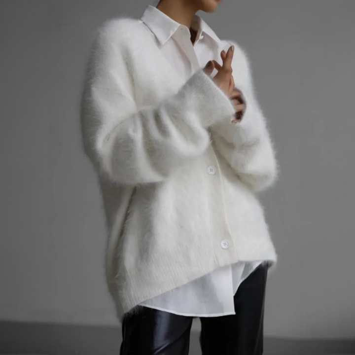 Modern oversized damesvest, gebreid, casual en chique voor diverse outfits.