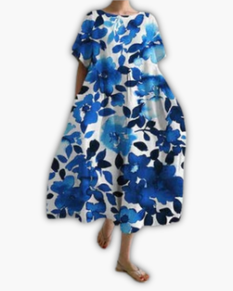 Dames midi-jurk met bloemenprint, oversized pasvorm, ronde hals en comfortabele korte mouwen, zomerklaar.