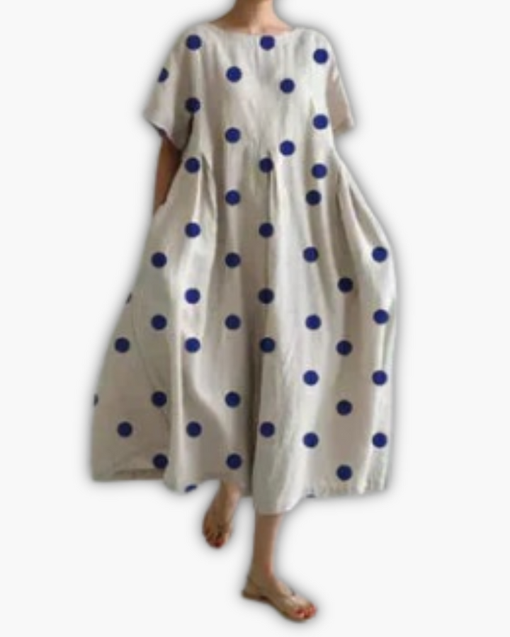 Zomerse oversized damesjurk, comfortabel model met ronde hals, bladprint en casual look.