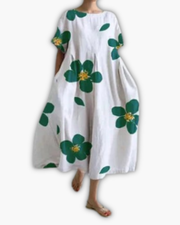 Comfortabele oversized zomerjurk voor dames, midi-lengte, ronde hals en trendy bladprint.