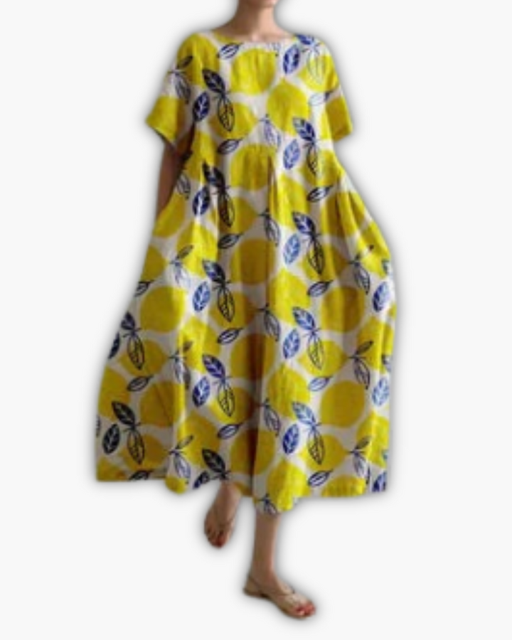 Stijlvolle midi-jurk dames met stippenprint, oversized, ronde hals en korte mouwen, ideaal voor casual zomer.