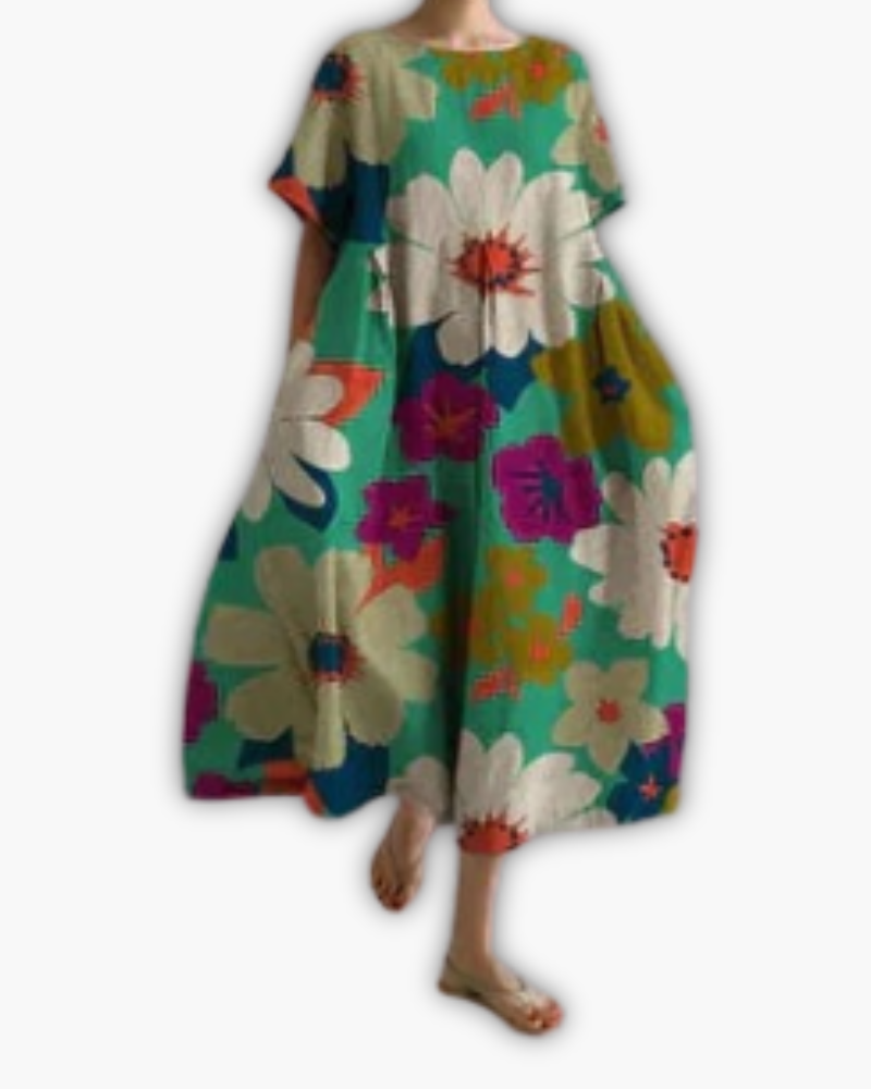 Comfortabele zomerse damesjurk, oversized midi-model met ronde hals en speelse stippenprint.