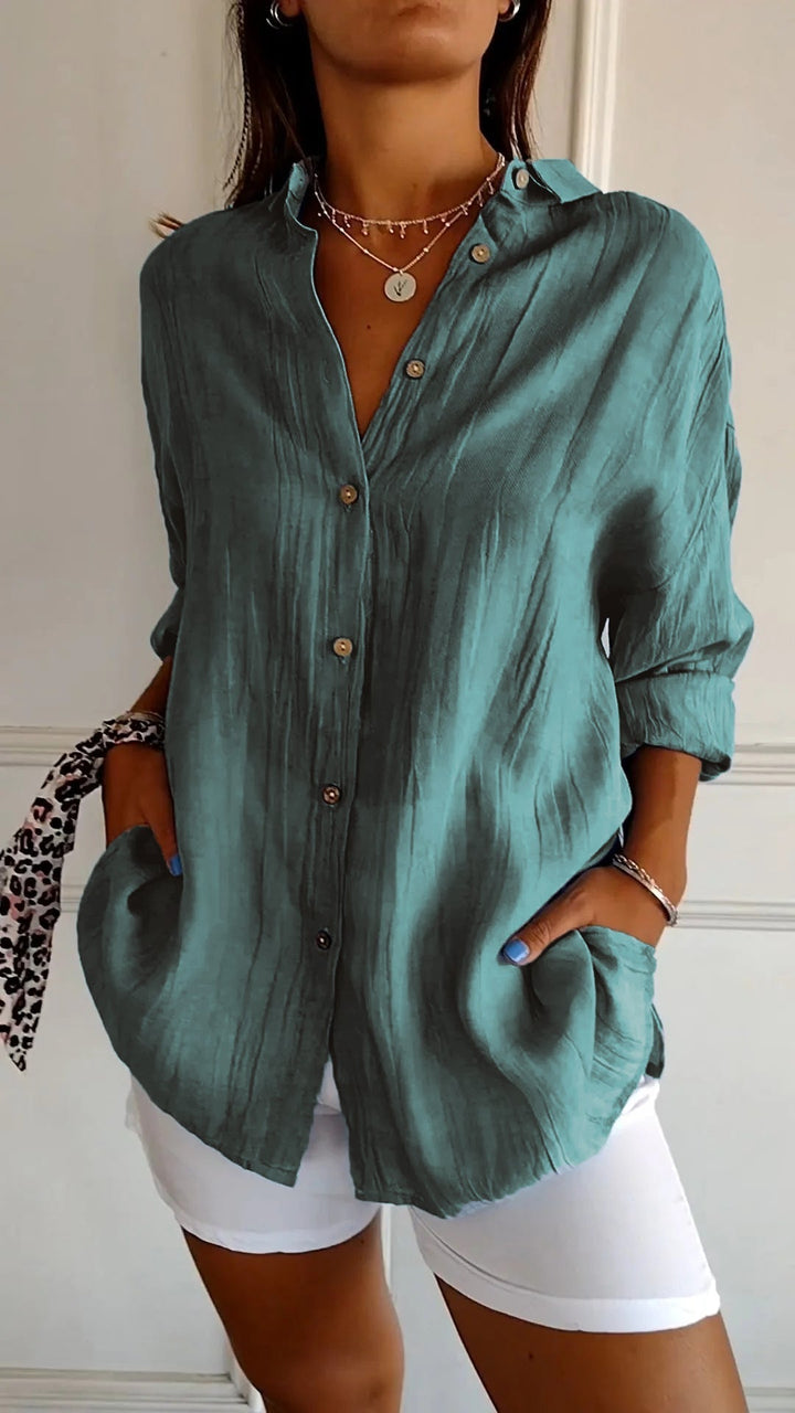 Stijlvol dames shirt met knoopsluiting, lange mouwen en zijzakken. Trendy en veelzijdig.