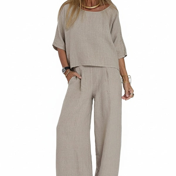 Dames oversized tweedelige co-ord set: comfortabele korte mouw top en wijde broek in lichtgrijs voor een casual zomerlook.
