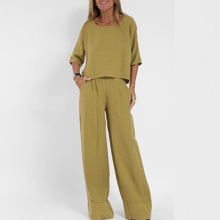 Zwarte dames oversized set met korte mouw en wijde broek, ideaal voor een comfortabele en casual outfit in de zomer.