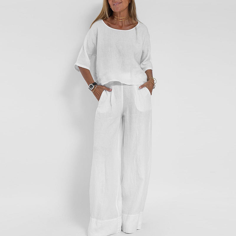 Trendy lichtgrijze tweedelige dames set: oversized top met korte mouw en elegante wijde broek voor ultiem comfort.
