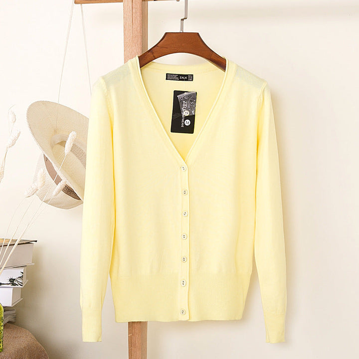 Dames pastel vest met V-hals, lange mouwen en knoopsluiting. Comfortabel en stijlvol voor lente/zomer.