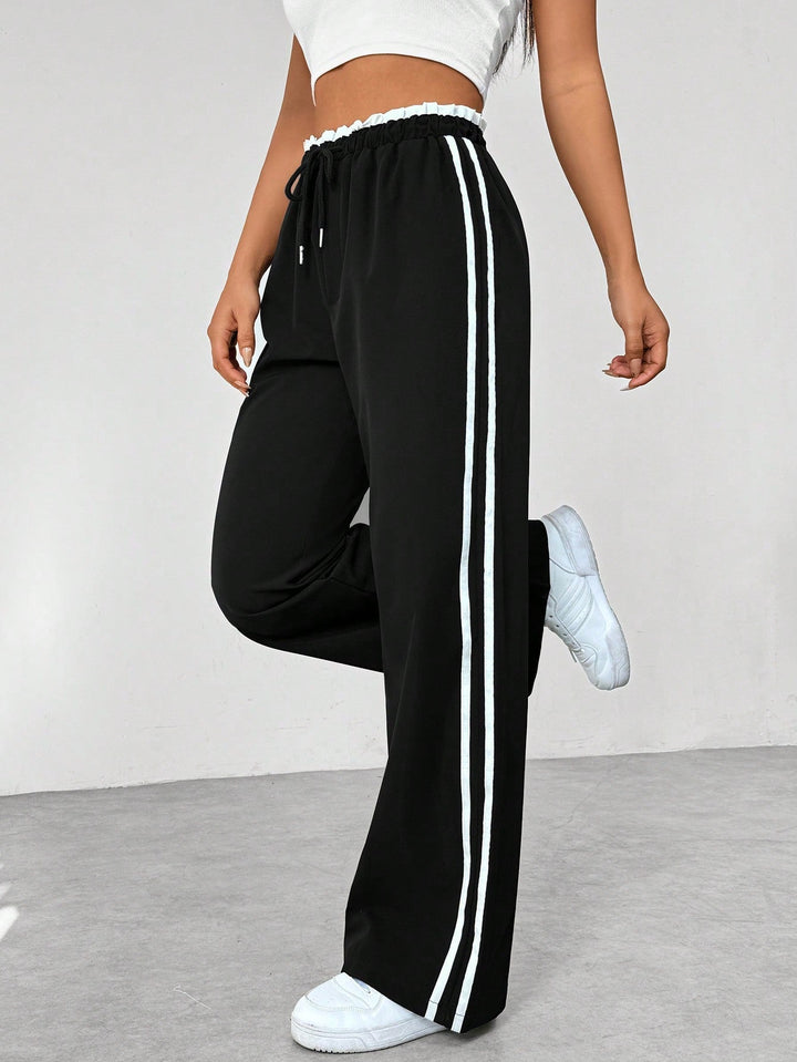 Dames rechte joggingsbroek met trekkoord, comfortabele losse pasvorm voor sportieve of casual lente/herfst outfit.