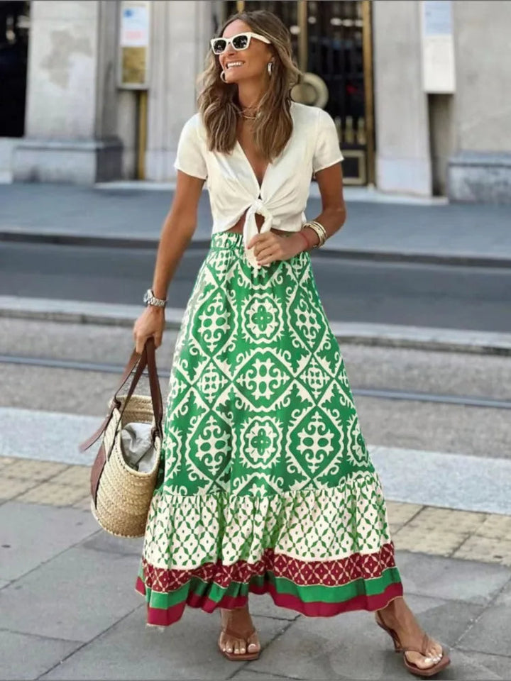 Dames retro midi rok met elegante, meerkleurige print. Stijlvol en comfortabel voor de zomer.