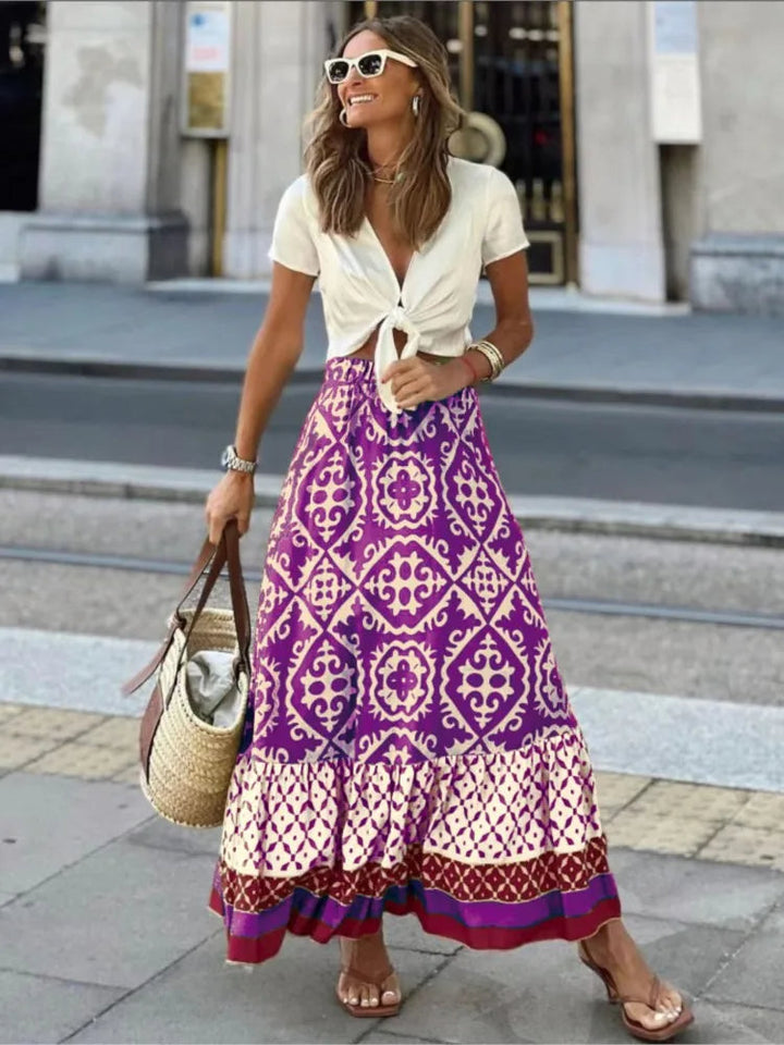 Zwierige geplooide dames midi rok met retro print. Elegante en comfortabele zomerrok, perfect voor elke gelegenheid.