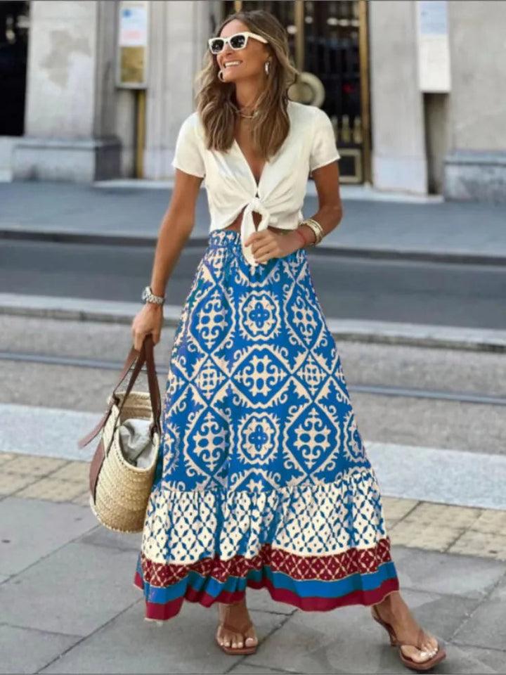 Stijlvolle dames midi rok met retro print, ideaal voor zomerse dagen. Comfortabel en elegant, van casual tot chic.